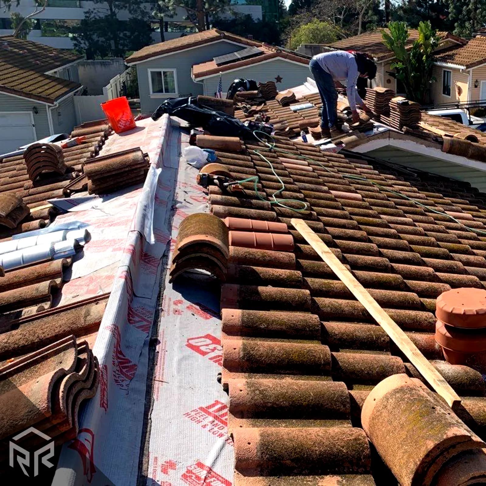 Resilient Roofing crew working on a tile roof in San Diego