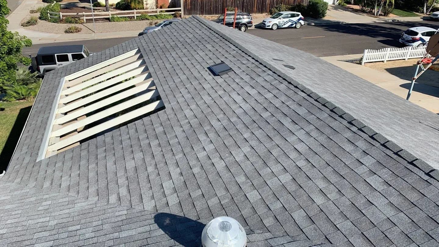 A reroof in progress with the wood roof decking fully exposed, ready for new underlayment.