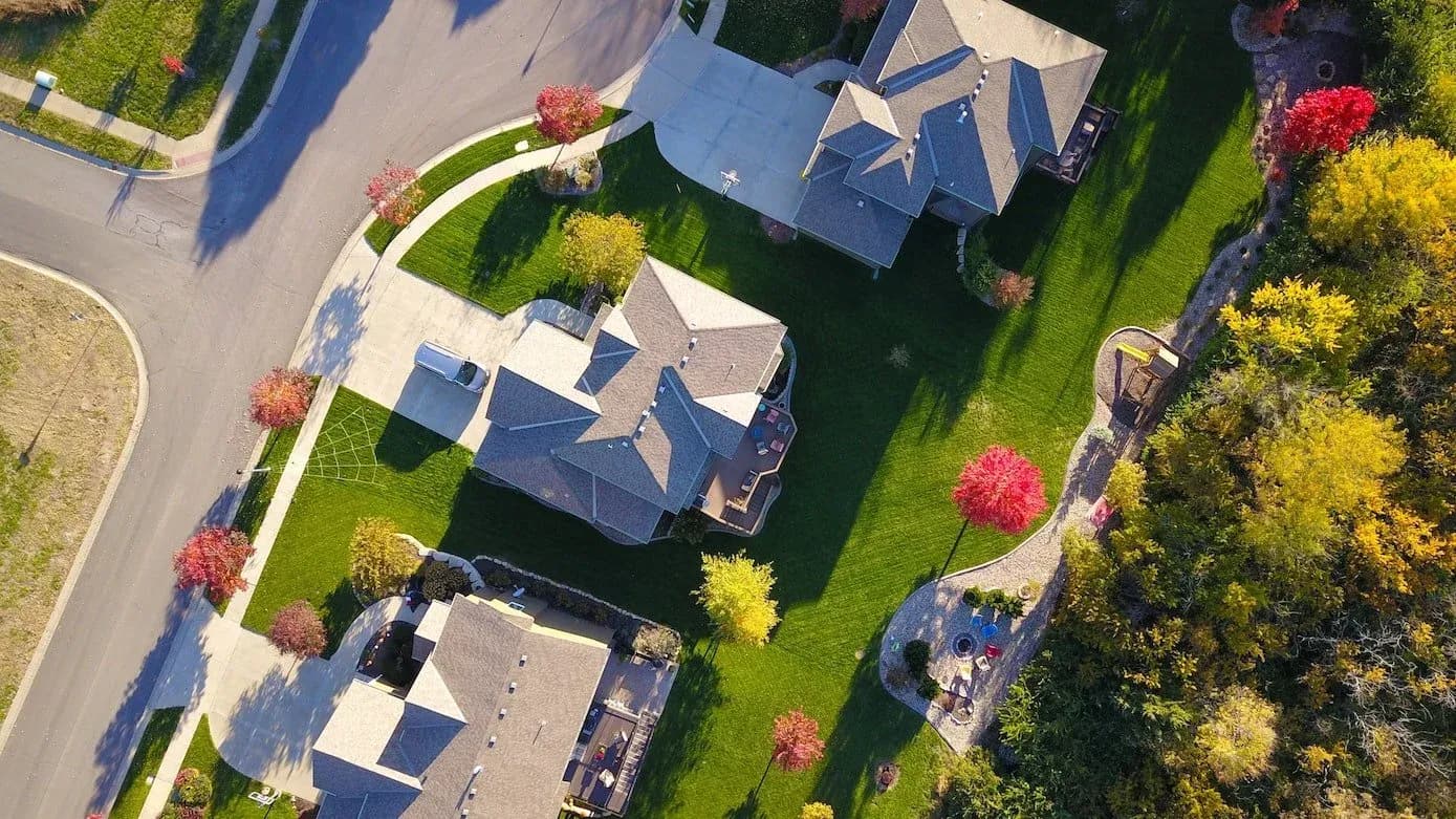 An overhead view of suburban rooftops and the edges where drip edge does its work.